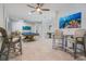 Game room features pool table, seating, and ocean-themed art at 112 Mangrove Ave, Anna Maria, FL 34216