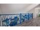 Upper hallway with unique railing and light flooring at 112 Mangrove Ave, Anna Maria, FL 34216