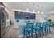 Modern kitchen with stainless steel appliances and marble countertops at 112 Mangrove Ave, Anna Maria, FL 34216