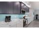 Modern kitchen with stainless steel appliances at 112 Mangrove Ave, Anna Maria, FL 34216