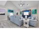 Relaxing living room featuring coastal art and comfortable seating at 112 Mangrove Ave, Anna Maria, FL 34216