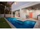 L-shaped pool and patio with outdoor kitchen and bar at 112 Mangrove Ave, Anna Maria, FL 34216
