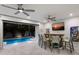 Indoor pool area with bar and seating, opens to outdoor patio at 112 Mangrove Ave, Anna Maria, FL 34216