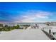 Aerial view of beach neighborhood with ocean sunset at 116 8Th Street S, Bradenton Beach, FL 34217