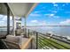 Relaxing balcony overlooking the water with comfortable seating at 116 8Th Street S, Bradenton Beach, FL 34217