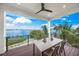 Covered balcony with outdoor dining set and stunning water views at 116 8Th Street S, Bradenton Beach, FL 34217