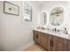 Modern bathroom with double vanity and large mirrors at 116 8Th Street S, Bradenton Beach, FL 34217
