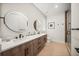 Modern bathroom with double vanity and walk-in shower at 116 8Th Street S, Bradenton Beach, FL 34217