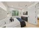 Serene bedroom featuring a king-size bed and a flat-screen TV at 116 8Th Street S, Bradenton Beach, FL 34217