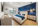 Bedroom with blue accent wall and modern furnishings at 116 8Th Street S, Bradenton Beach, FL 34217