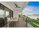 Spacious deck with water views and outdoor dining furniture at 116 8Th Street S, Bradenton Beach, FL 34217