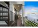 Deck with spiral staircase and seating area, water views at 116 8Th Street S, Bradenton Beach, FL 34217