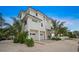 Three-story house, white exterior, two-car garage at 116 8Th Street S, Bradenton Beach, FL 34217