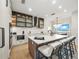 Modern kitchen with a large island, white quartz countertops, and water views at 116 8Th Street S, Bradenton Beach, FL 34217