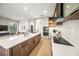 Modern kitchen with island, stainless steel appliances, and white cabinets at 116 8Th Street S, Bradenton Beach, FL 34217