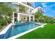 Modern pool and spa with a swim-up bar at 116 8Th Street S, Bradenton Beach, FL 34217