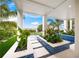 Landscaped pool area with built-in planters and blue tile accents at 116 8Th Street S, Bradenton Beach, FL 34217