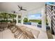 Spacious patio with lounge chairs and stunning waterfront views at 116 8Th Street S, Bradenton Beach, FL 34217