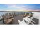 Rooftop deck with multiple chairs and water views at 116 8Th Street S, Bradenton Beach, FL 34217