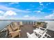 Spacious rooftop deck with multiple chairs and amazing water views at 116 8Th Street S, Bradenton Beach, FL 34217