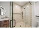 Walk-in shower with patterned tile and glass enclosure at 116 8Th Street S, Bradenton Beach, FL 34217