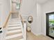 Modern staircase with glass railing and light wood at 116 8Th Street S, Bradenton Beach, FL 34217