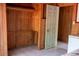 Bedroom with wood walls and tile flooring at 1205 Willis Ave, Sarasota, FL 34232