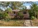 Ranch-style house with a deck and landscaping at 1205 Willis Ave, Sarasota, FL 34232