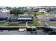 Aerial view showing home's canal-front location, pool, and dock at 128 Sinclair Se St, Port Charlotte, FL 33952