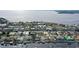 Aerial view highlighting waterfront property with private dock and canal access at 128 Sinclair Se St, Port Charlotte, FL 33952