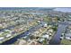 Aerial view of waterfront home community, showcasing canals and houses at 128 Sinclair Se St, Port Charlotte, FL 33952