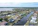 Aerial showing home's waterfront location with private dock and canal views at 128 Sinclair Se St, Port Charlotte, FL 33952