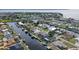 Aerial view of canal-front home with private dock and spacious backyard at 128 Sinclair Se St, Port Charlotte, FL 33952
