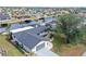 Aerial view of single story home with attached garage and waterfront access at 128 Sinclair Se St, Port Charlotte, FL 33952