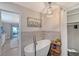 Bathroom boasts a free-standing tub and walk-in shower at 128 Sinclair Se St, Port Charlotte, FL 33952