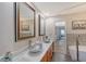 Elegant bathroom with double vanity, soaking tub, and walk-in shower at 128 Sinclair Se St, Port Charlotte, FL 33952