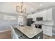 Modern kitchen with granite countertops and stainless steel appliances at 128 Sinclair Se St, Port Charlotte, FL 33952