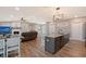 Open floor plan with kitchen island and living room with fireplace at 128 Sinclair Se St, Port Charlotte, FL 33952