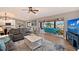 Open living space with water views, fireplace, and comfortable seating at 128 Sinclair Se St, Port Charlotte, FL 33952