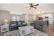 Bright living room with cozy seating and views to kitchen at 128 Sinclair Se St, Port Charlotte, FL 33952
