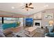 Living room with water views, fireplace, and comfortable seating at 128 Sinclair Se St, Port Charlotte, FL 33952