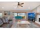 Living room with water views and comfortable seating at 128 Sinclair Se St, Port Charlotte, FL 33952