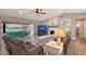 Living room with water views, fireplace, and comfortable seating at 128 Sinclair Se St, Port Charlotte, FL 33952