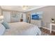 Main bedroom with king-size bed and en-suite bathroom at 128 Sinclair Se St, Port Charlotte, FL 33952