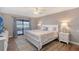 Main bedroom with king-size bed and private access to patio at 128 Sinclair Se St, Port Charlotte, FL 33952