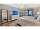 Main bedroom with large bed, dresser, and access to patio at 128 Sinclair Se St, Port Charlotte, FL 33952