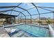 Enclosed pool with spa and waterfront views at 128 Sinclair Se St, Port Charlotte, FL 33952