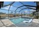 Enclosed pool with spa and waterfront views at 128 Sinclair Se St, Port Charlotte, FL 33952