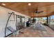 Covered patio with seating, ceiling fan, and water views at 128 Sinclair Se St, Port Charlotte, FL 33952