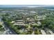 Community overview showcasing lush landscaping and tennis courts at 144 Wild Palm Dr, Bradenton, FL 34210